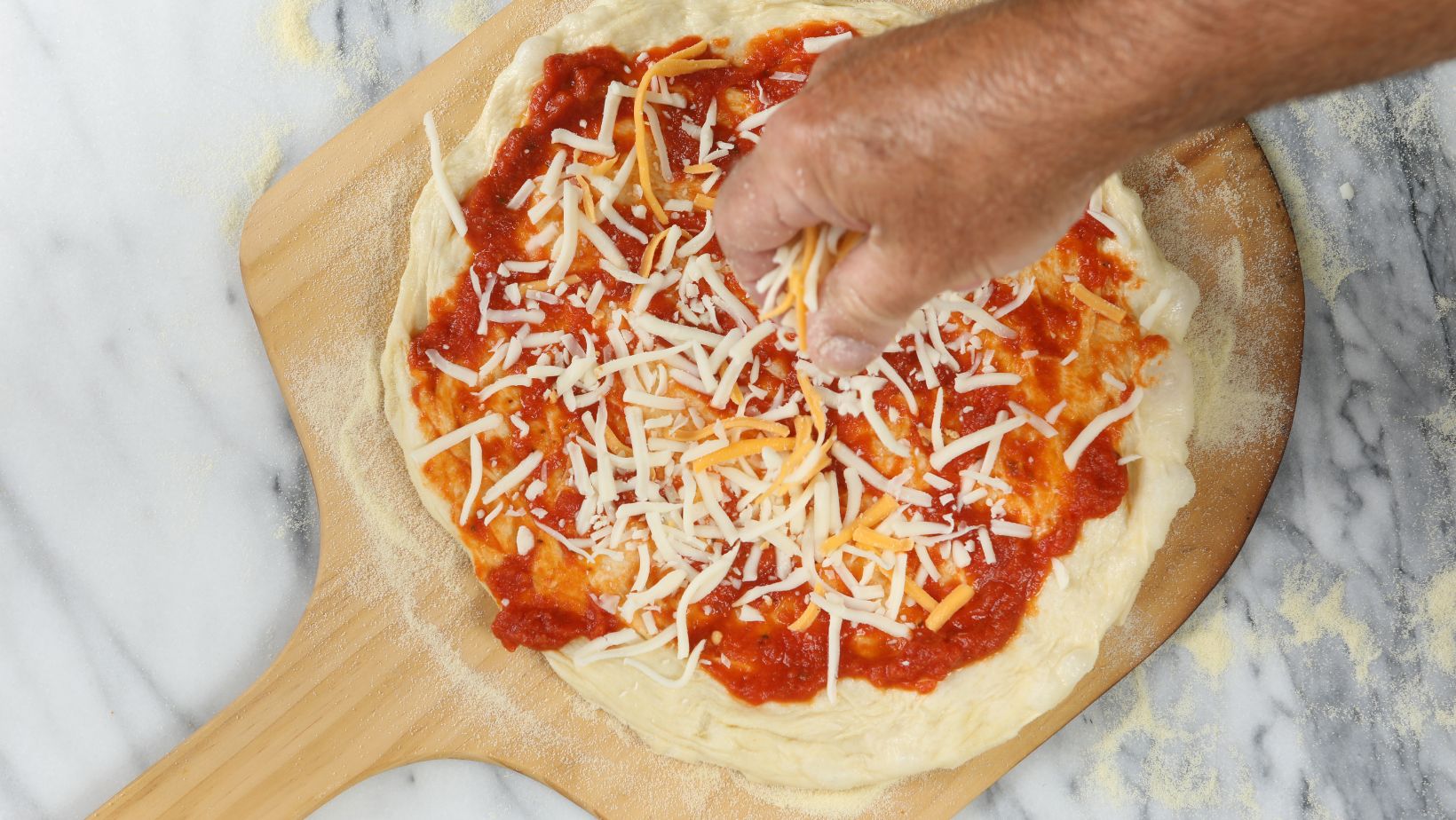 Topping Pizza With Cheese